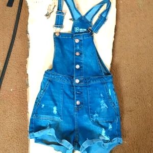 Neatly washed out blue jean suspenders